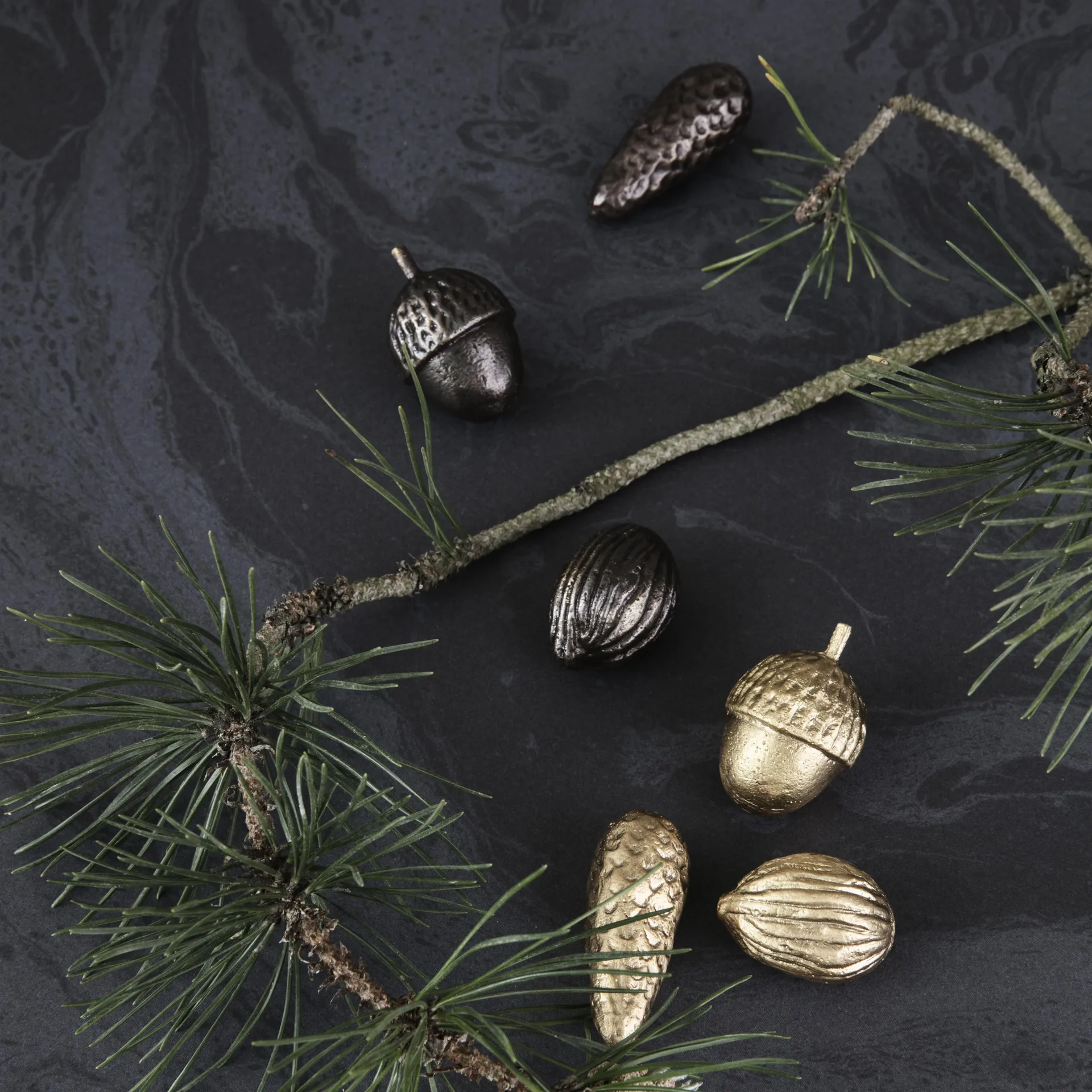 Winterland acorn/pine cone ornaments, brass Ferm Living