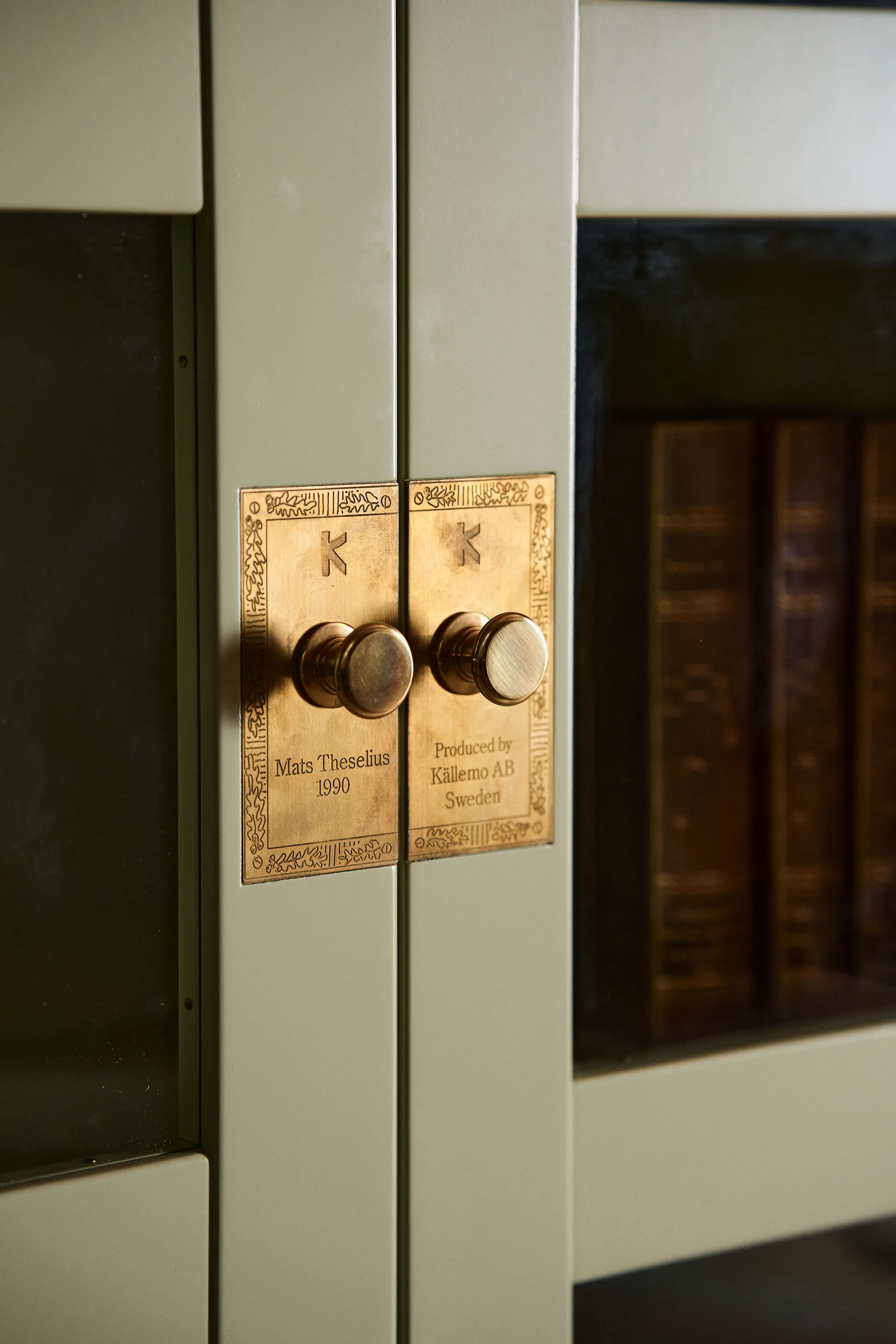 National Geographic bookcase, Yellow-plinth-base-brass Källemo