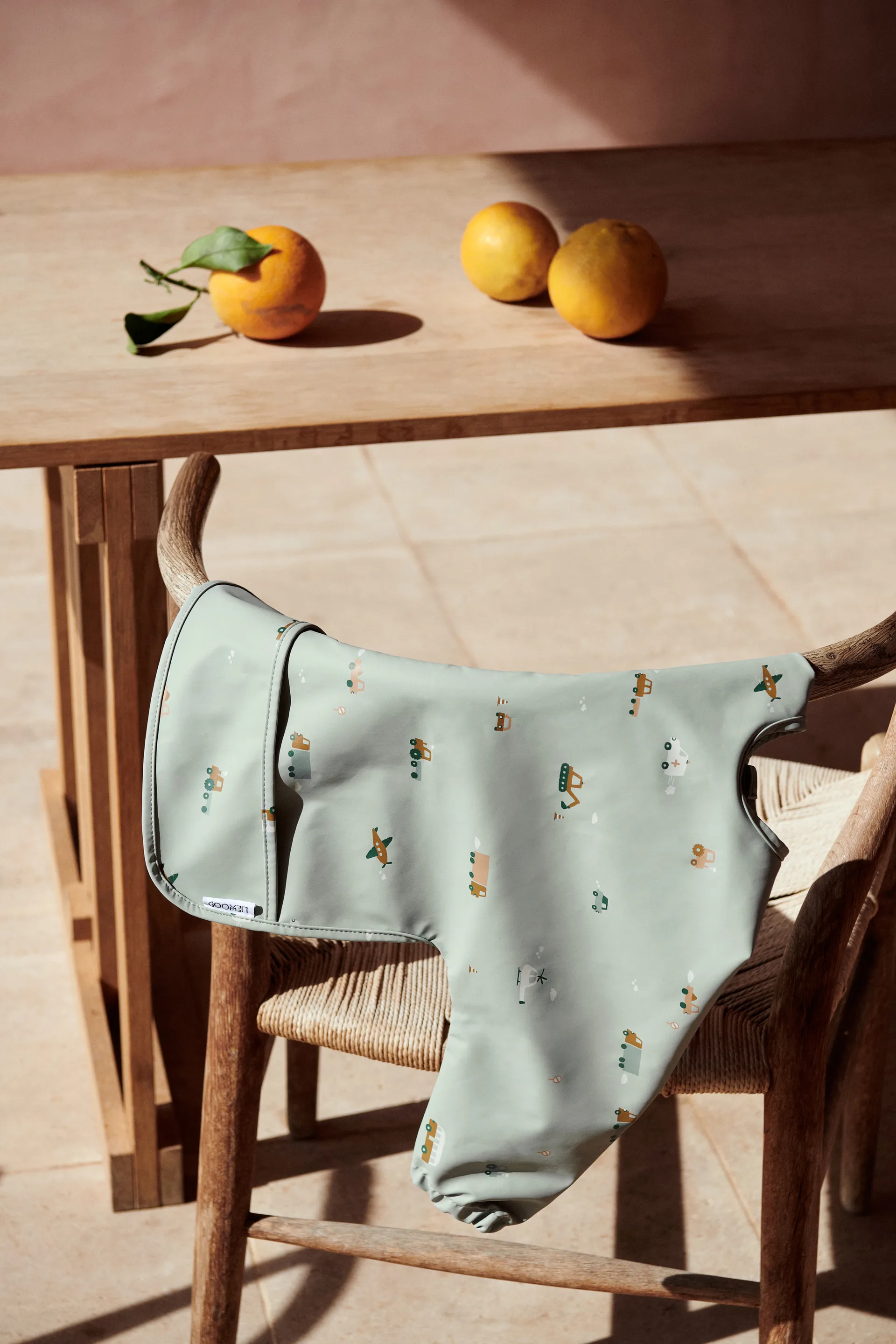 Merle bib with sleeve, Vehicles-dove blue mix Liewood