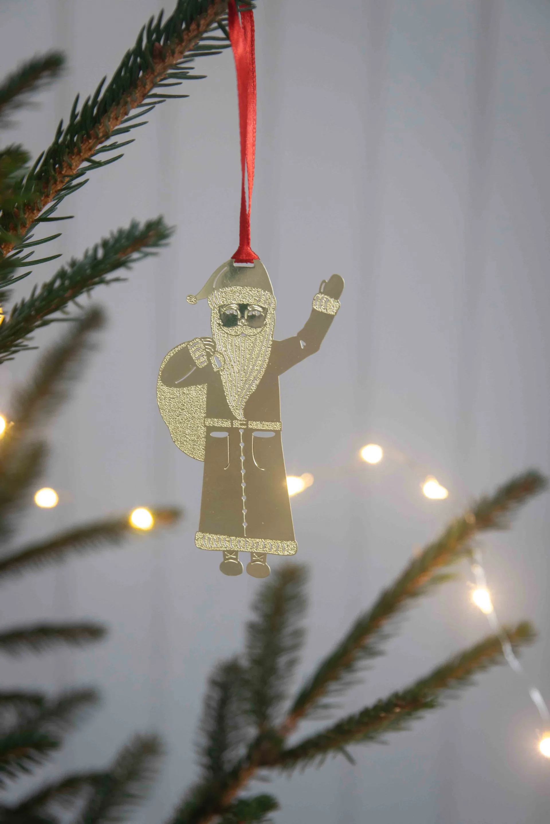 Claus decorative hanging ornament, Gold Pluto Design