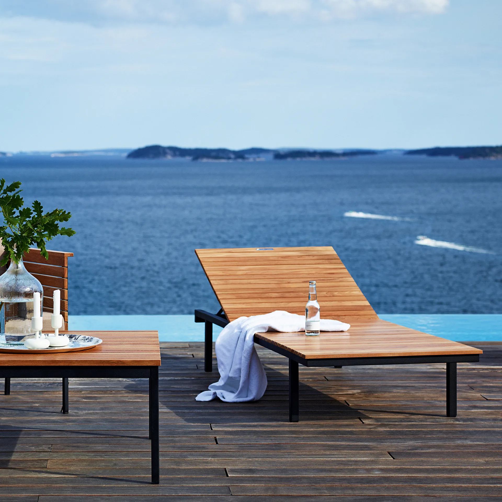 Häringe coffee table, Teak, small, black steel frame Skargaarden