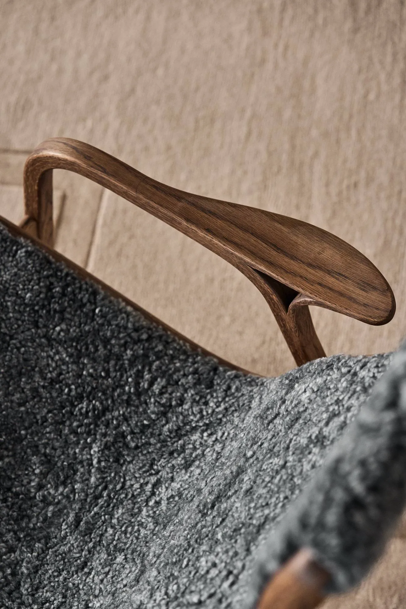 Lamino armchair and footstool, Sheepskin Charcoal-Rubio Monocoat Chocolate Swedese