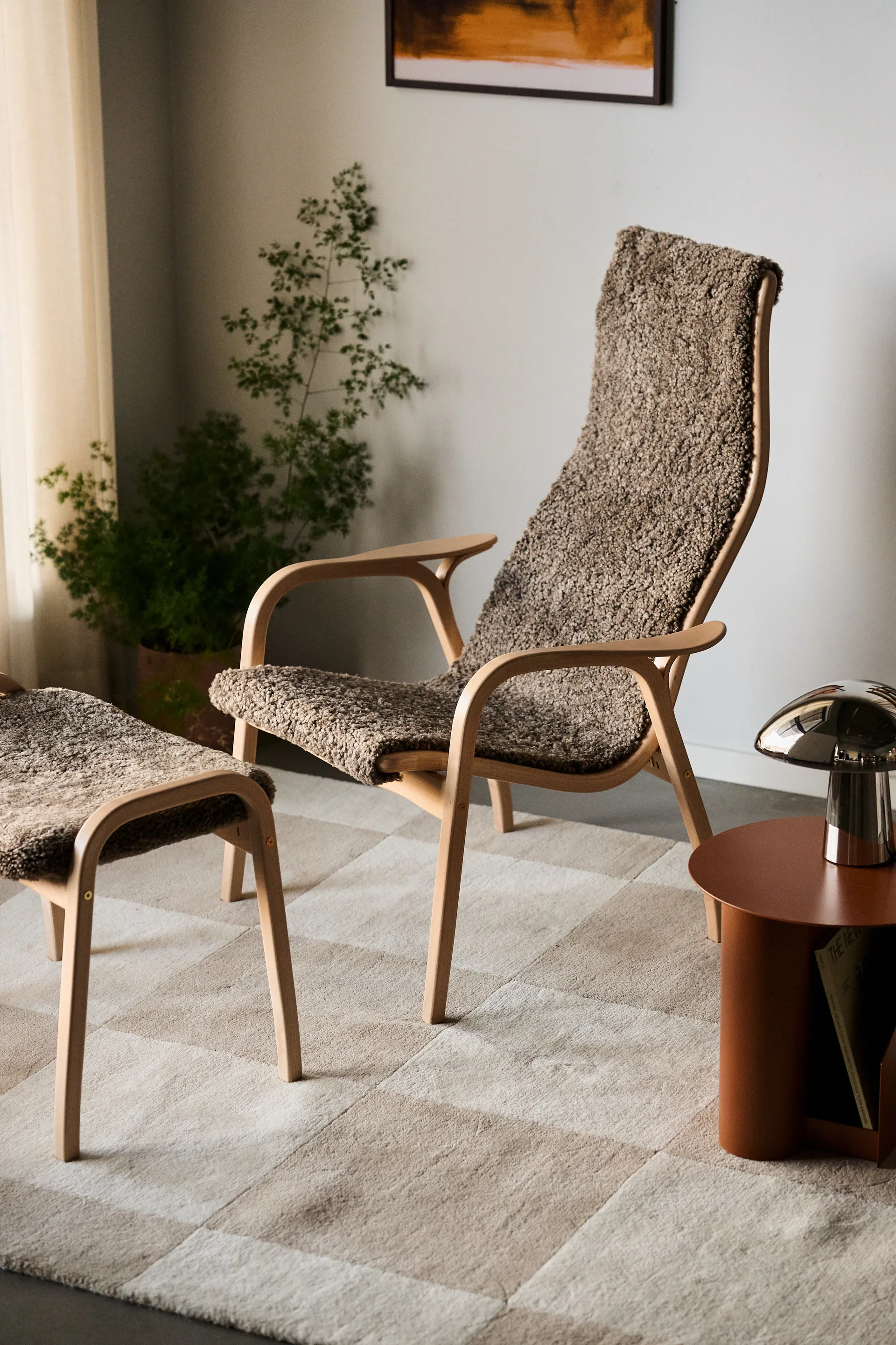 Lamino armchair and footstool varnished beech/sheepskin, Sahara (nougat-brown) Swedese