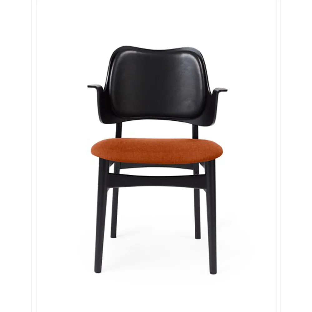 Warm Nordic Gesture chair, upholstered seat and back Fabric rusty rosé, leather backrest, black lacquered beech legs