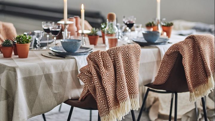 A modern table setting with the Salt wool throw from Scandi Living in a beautiful shade of terracotta. 