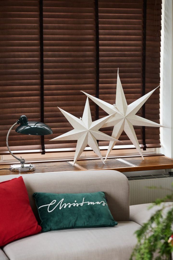 The Bare star from Scandi Living stands on the window sill next to the retro Kaiser lamps from Fritz Hansen. Part of the vintage Christmas decor.