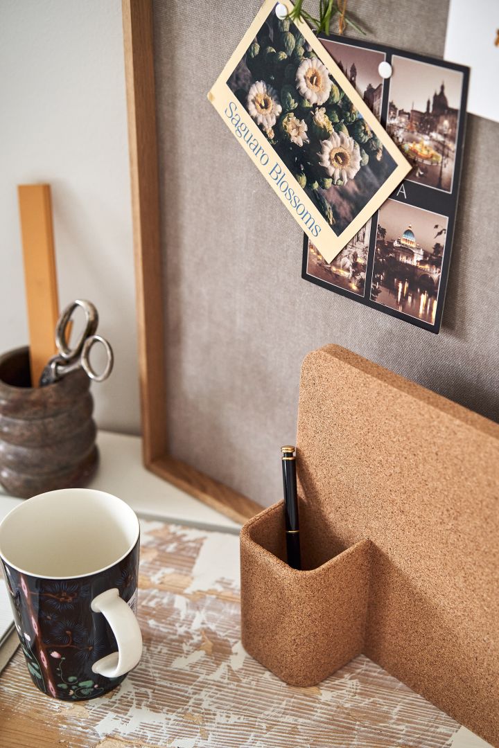 A cork pin board with a pen holder makes the perfect organiser for your desk in any small home office. 