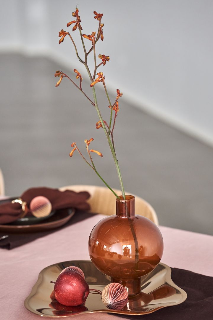 Decorate the Christmas table with Golden Oak round vase from Urban Nature Culture and the honeycomb bauble from Broste Copenhagen. These are some of the year's most stylish Christmas decorations for 2021.