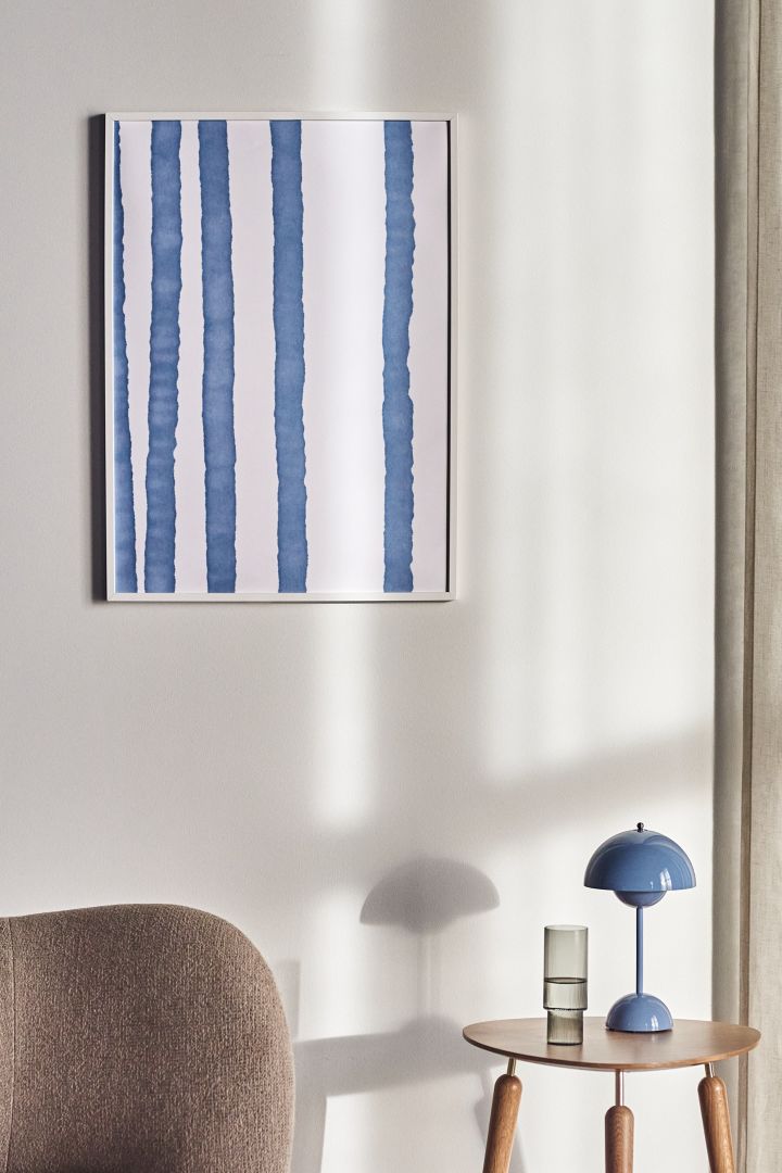 17 stylish Scandinavian wall posters to give your walls an update - here you see the graphic Lineage poster from Paper Collective in tones of blue and white.