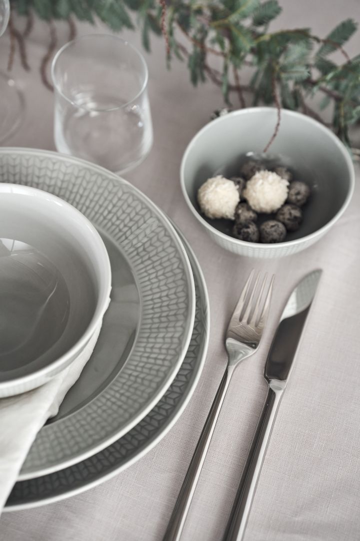 Close up of Swedish Grace from Rörstrand in the colour Mist on an elegant grey table setting idea.