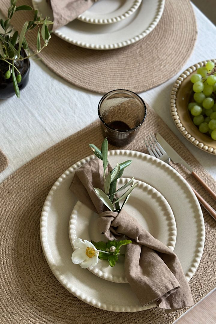 Close up of Swedish Grace from Rörstrand in the colour Mist on an elegant grey table setting idea.