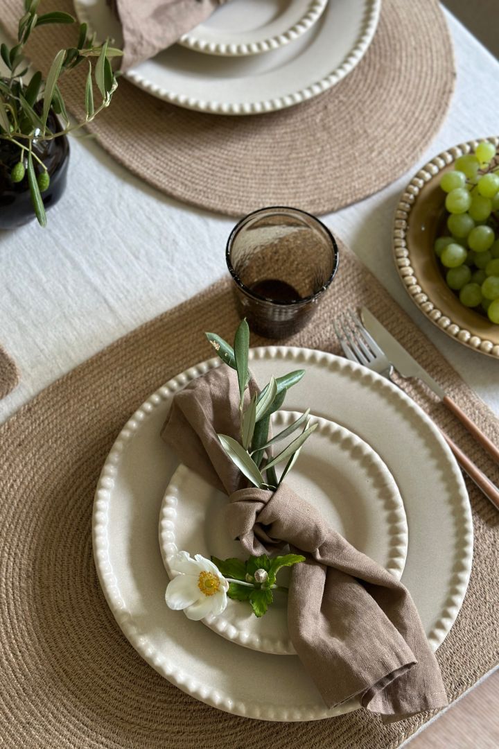 Close up of Swedish Grace from Rörstrand in the colour Mist on an elegant grey table setting idea.