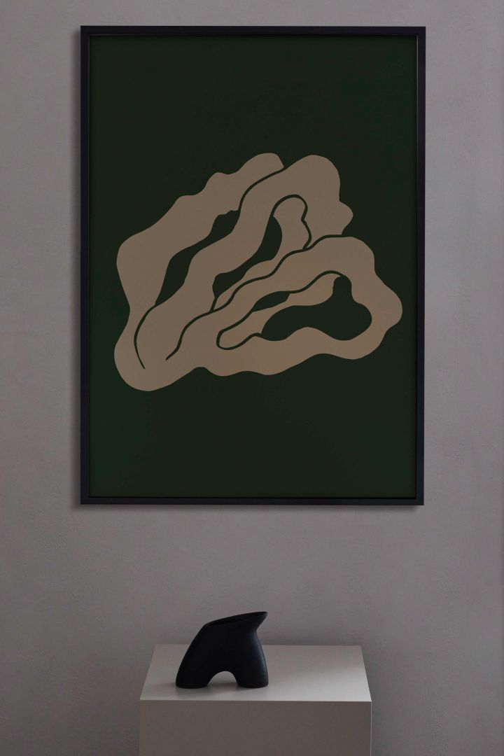 17 stylish Scandinavian wall posters to give your walls an update - here you see the abstract Coral 02 poster from Paper Collective in a dark green and beige.
