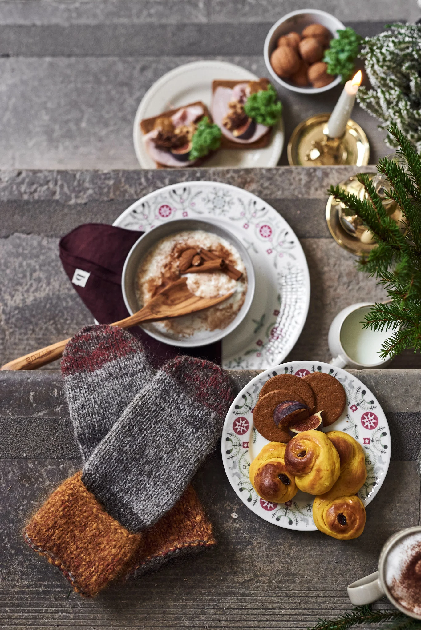 Giving the jultomte a bowl of Christmas porridge is an olde Christmas tradition. Here you see a bowl of porridge on a step with a plate of saffron buns.