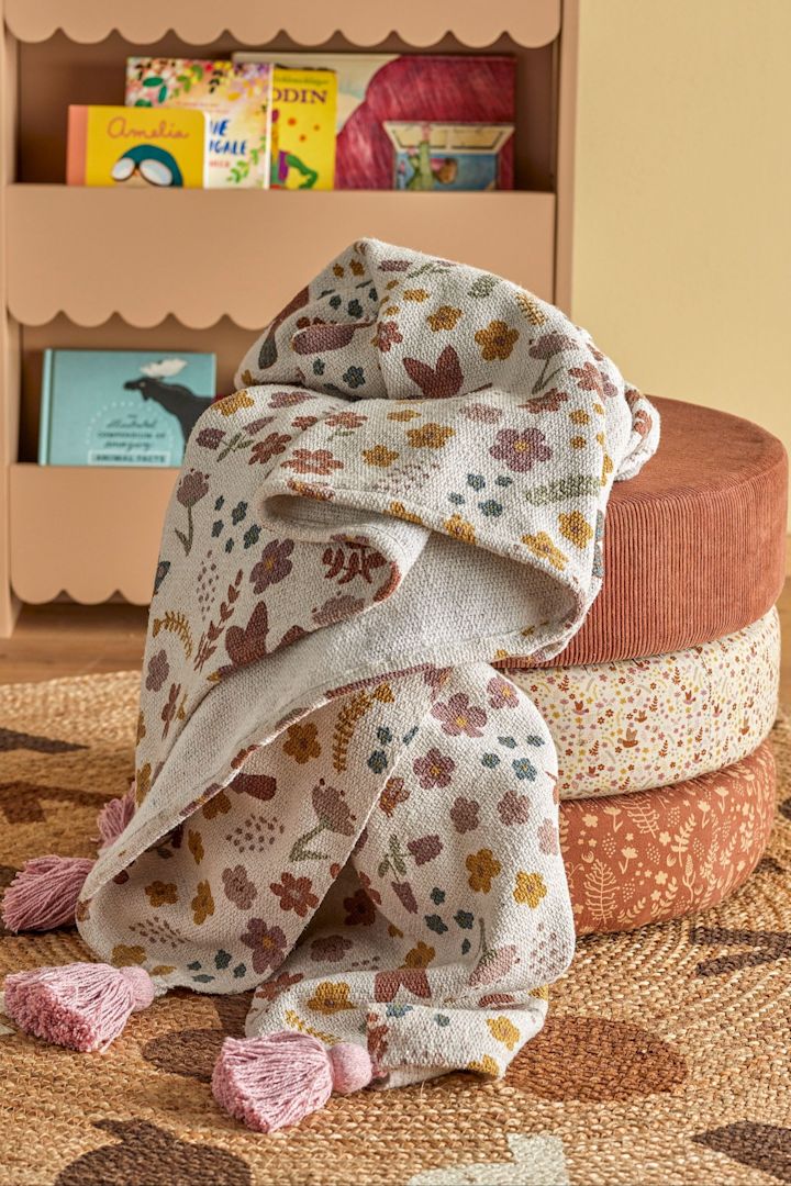 The Kristine wool blanket from Bloomingville keeps baby warm after the bath or in the cot, making it a thoughtful gift for the baby shower.