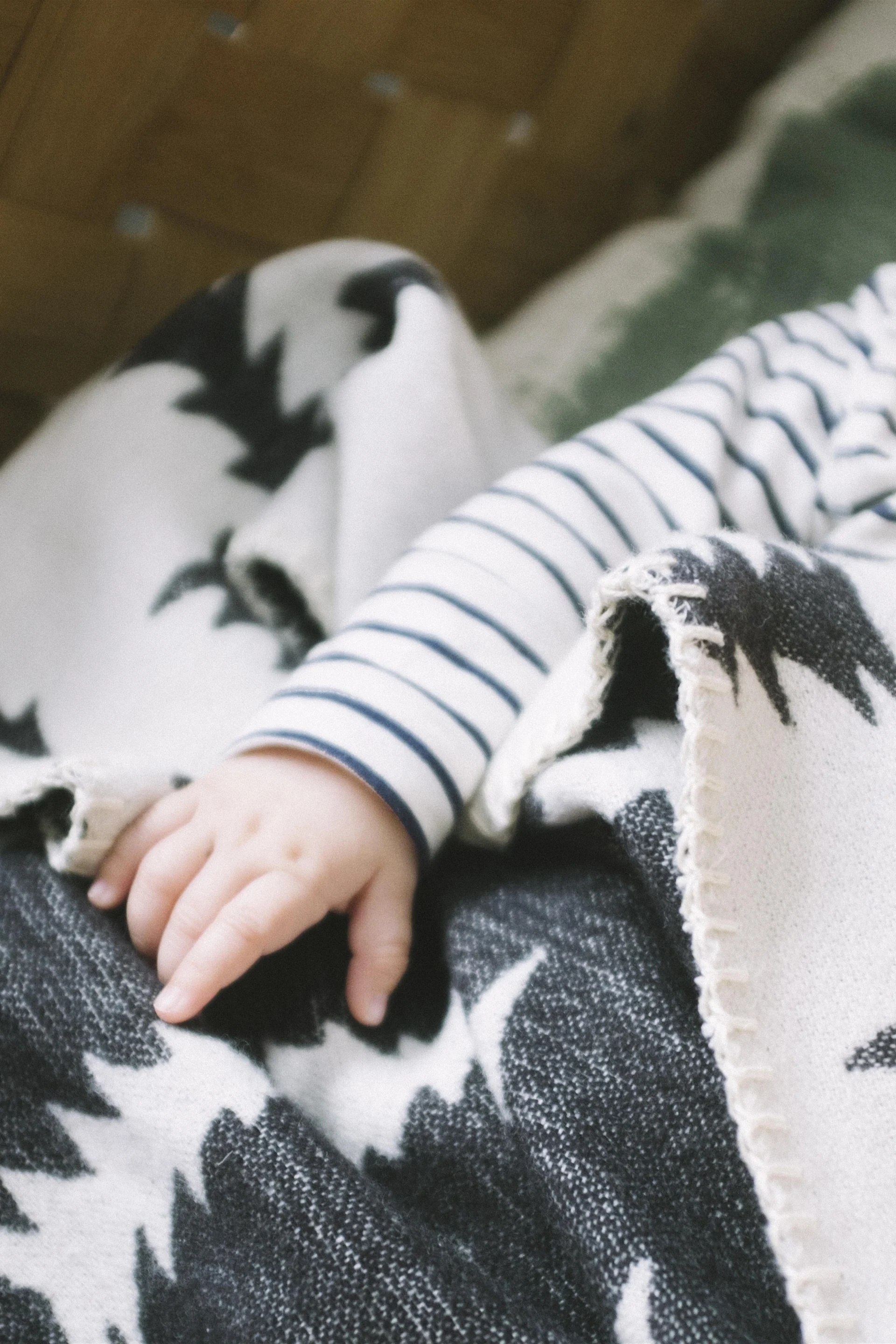 The Kristine wool blanket from Bloomingville keeps baby warm after the bath or in the cot, making it a thoughtful gift for the baby shower.