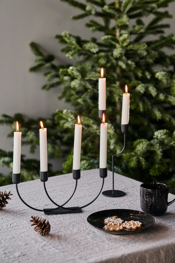How to decorate with traditional Scandinavian Christmas decorations - The joy candle stick in black from Scandi Living is an elegant candle holder that looks like as lovely on the sideboard as the dining table. 