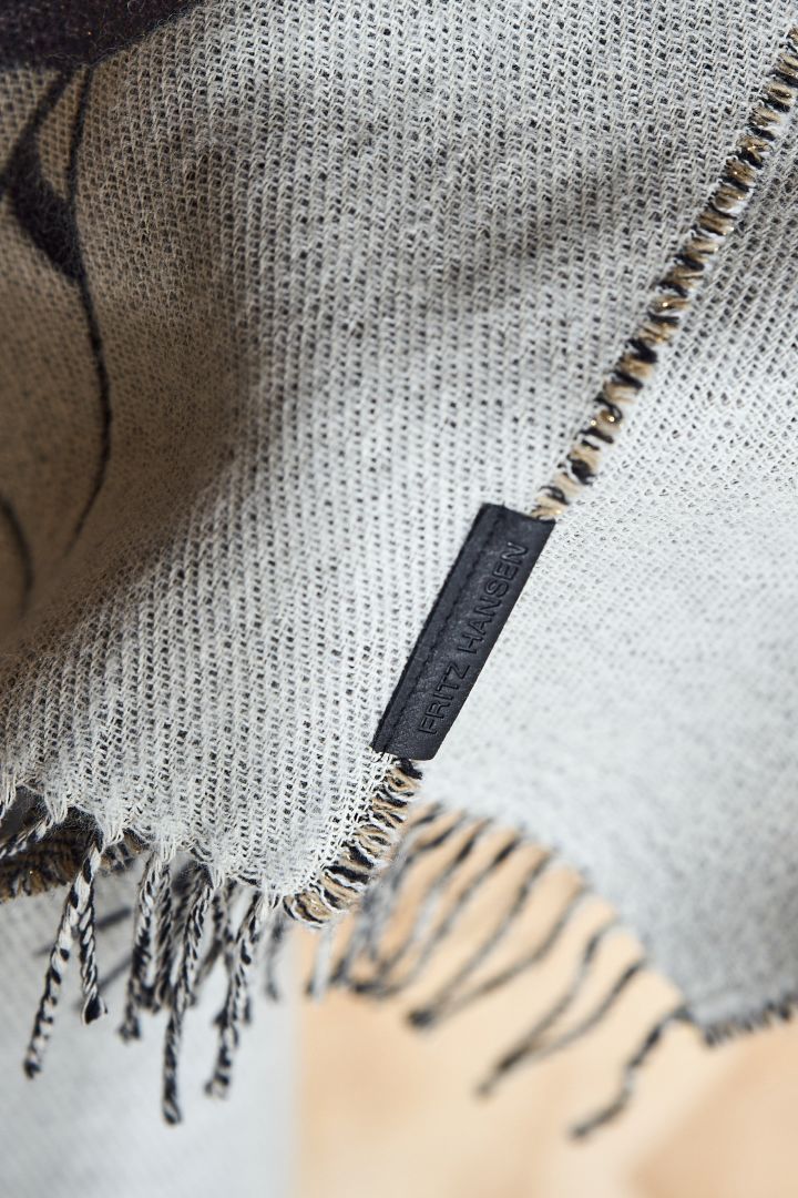 Here you see a close up of the Fritz Hansen label on the Jamie Hayon throw from Fritz Hansen.