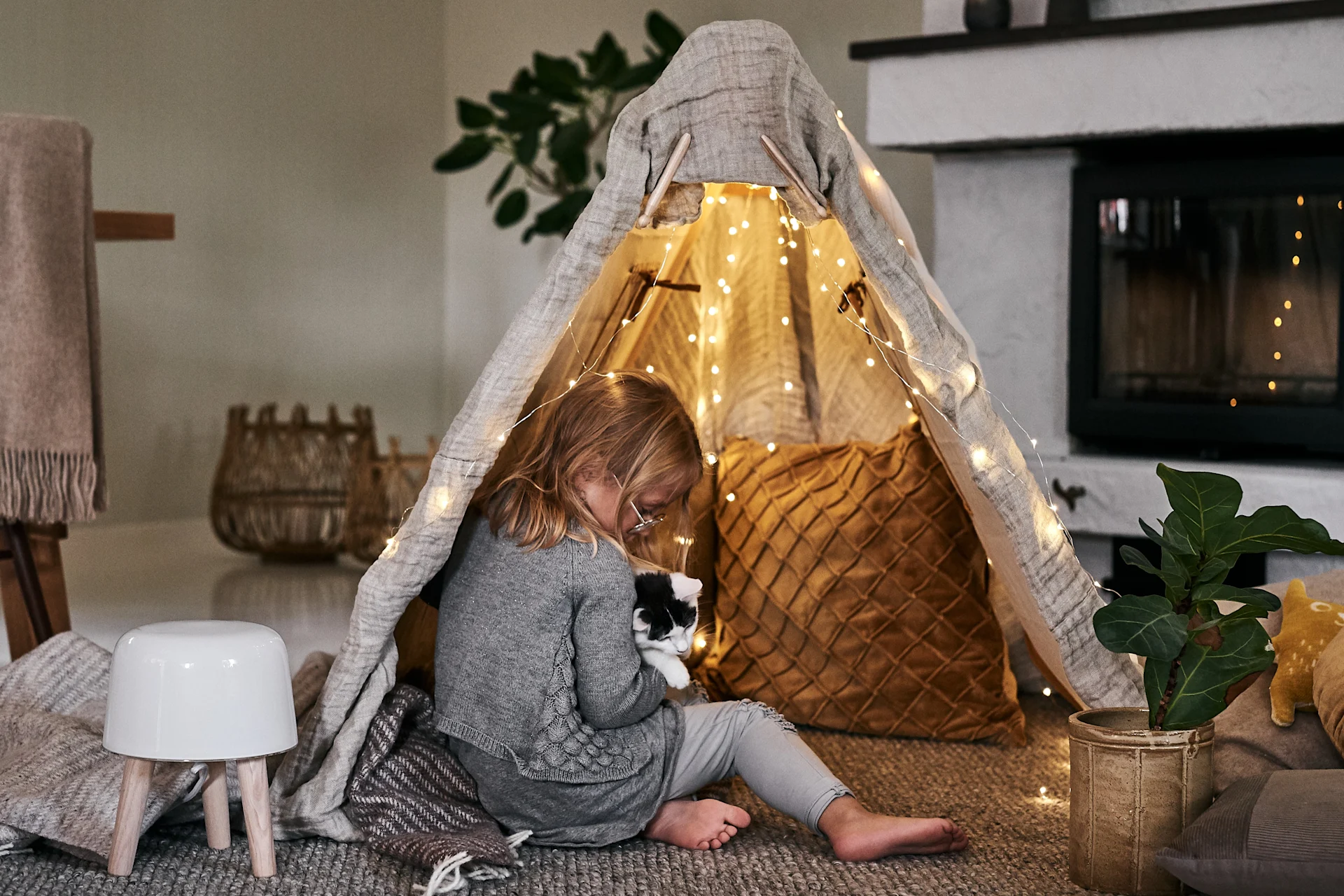 The Scandinavian lifestyle to try this winter - create a cosy corner in the living room for the kids.