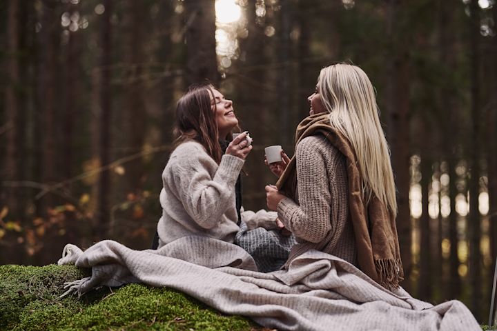 Scandinavian lifestyle things you need to try this winter - a picnic in the woods with lots of wool blankets.