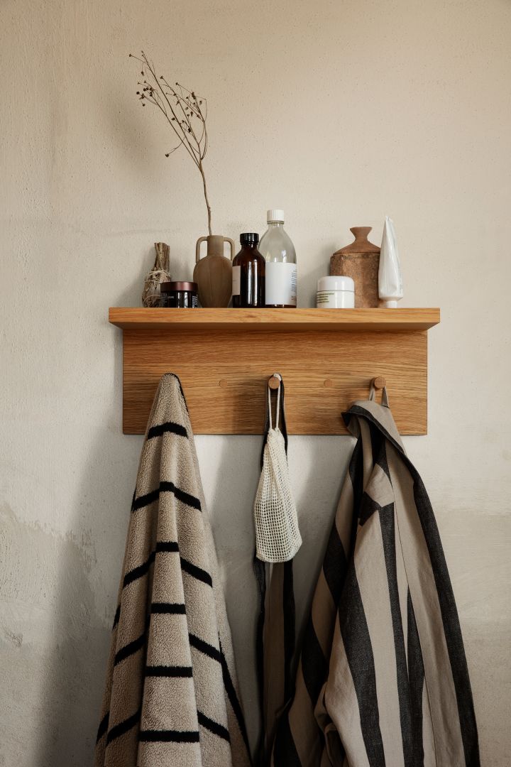 Storage ideas for small bathrooms - here you see the Place Rack shelf from Ferm Living, a shelf with built in hooks, a smart solution to storage in a small space. 