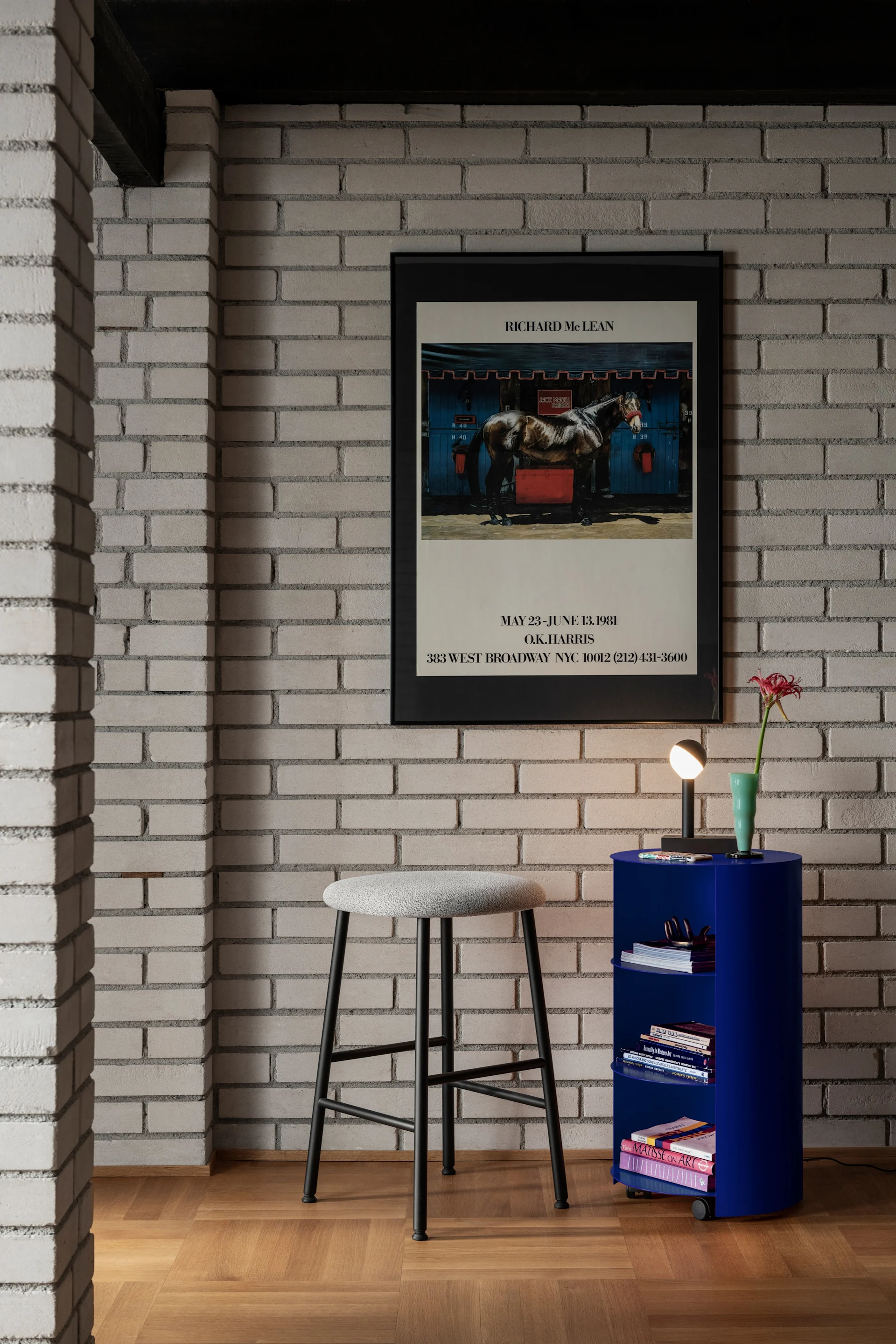 A bright blue side table on wheels with books, reflecting the interior colour trends for 2026.