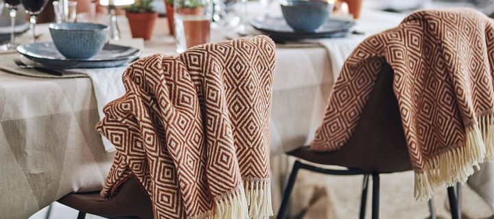 The Salt wool throw from Scandi Living is a soft throw that will help you create a cosy dining area. 