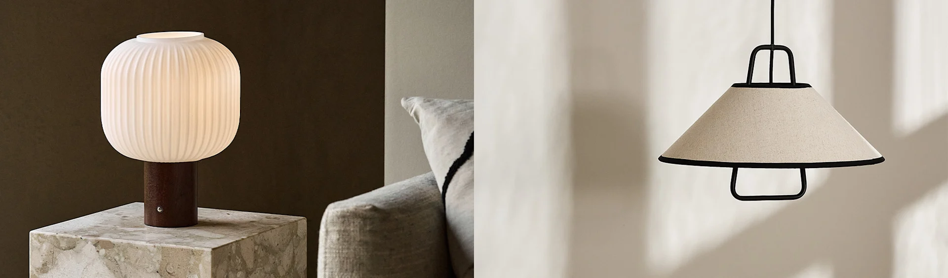 Ribbed white glass table lamp with a wooden base on marble, and a conical beige fabric pendant lamp with a black frame.