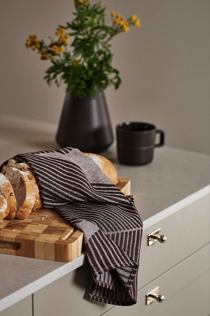 The NJRD brown tea towel wrapped around a loaf of crusty bread makes a great Christmas gift idea for food lovers. 
