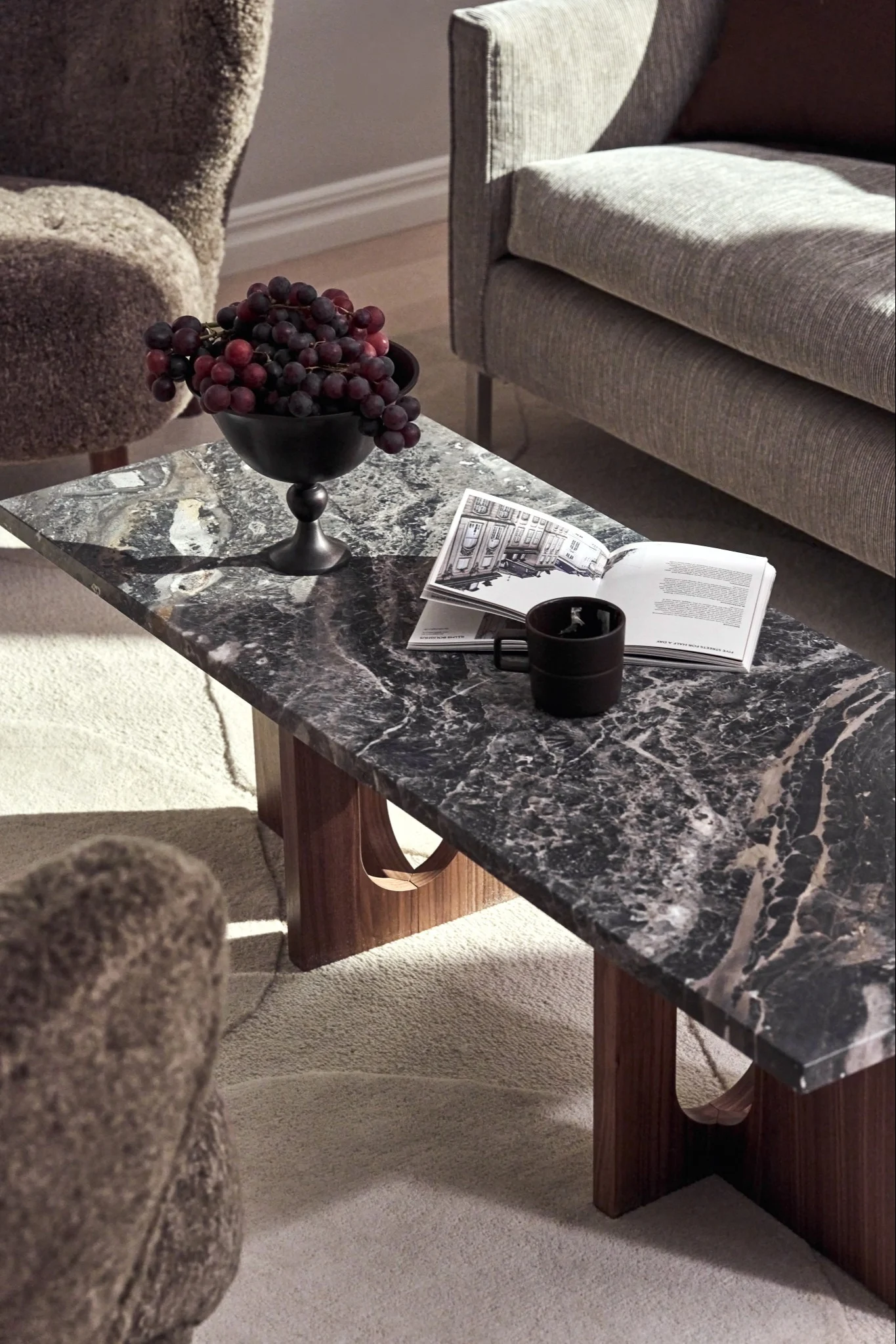 A stone table with small details on that reflect the interior design trends of 2026.