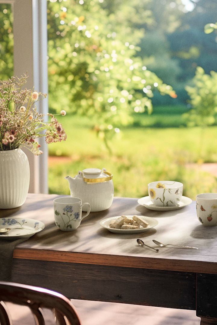 The Hammershoi summer collection on a wooden dining table in the summer sunshine. 