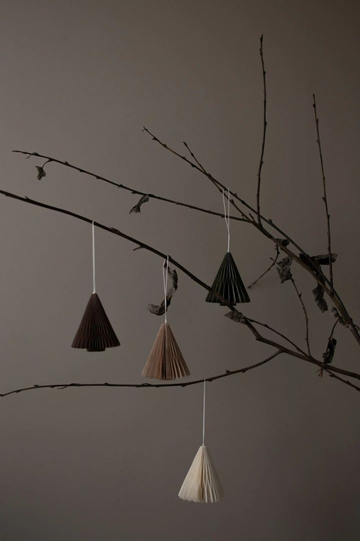 One of this year's Scandi Christmas decorations for 2022 from DBKD in the form of beautiful small paper trees to hang from branches or Christmas trees.
