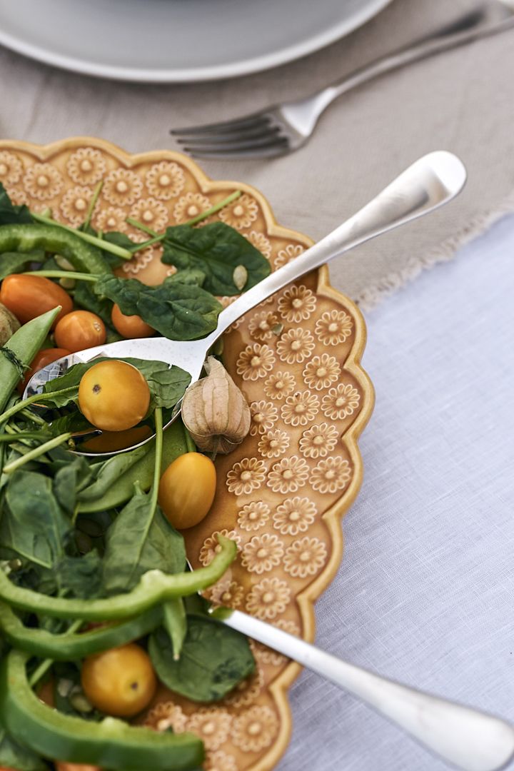How about a summery salad? Perfect for any occasion and served here on a yellow tray from PotteryJo. 