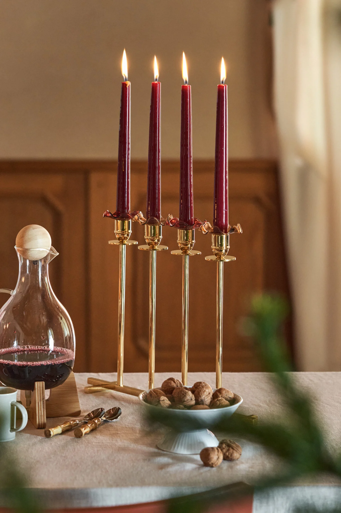Here you can see the stylish Alto candle holder from Hilke with four red candles in it.