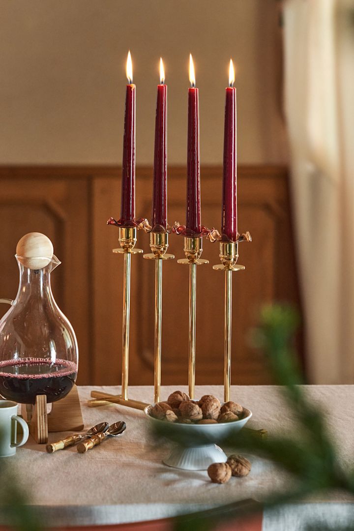 Here you can see the stylish Alto candle holder from Hilke with four red candles in it.