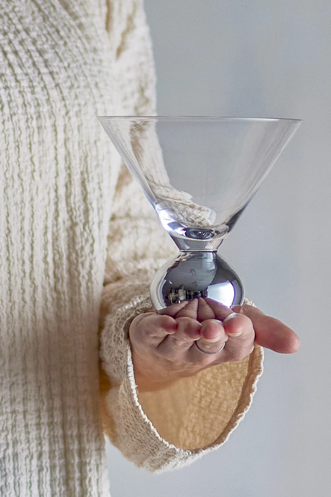 An elegant, festive glass with a round base and a wide opening, a perfect Christmas gift for anyone who appreciates a beautifully set table.