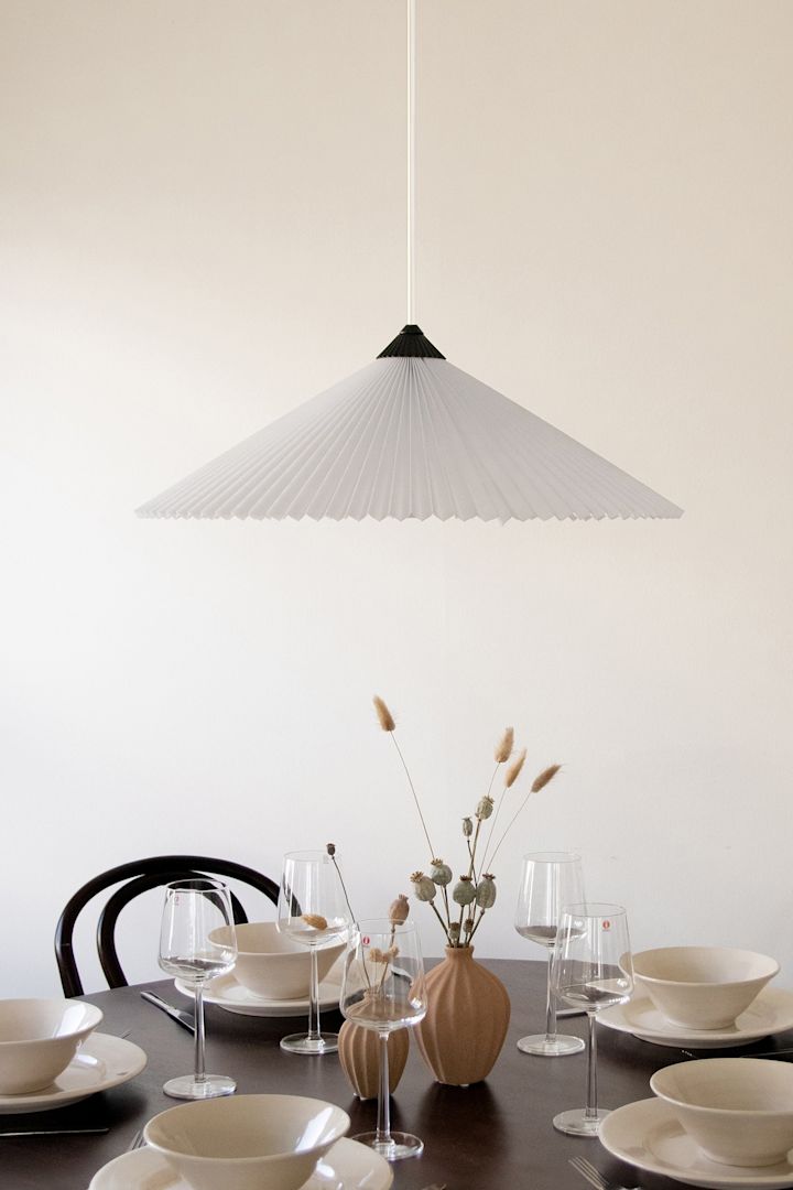 Refresh your home with modern pendant lamps - here you see Matisse pendant lamp from Globen Lighting in pleated material that creates a cozy feeling at dinners.