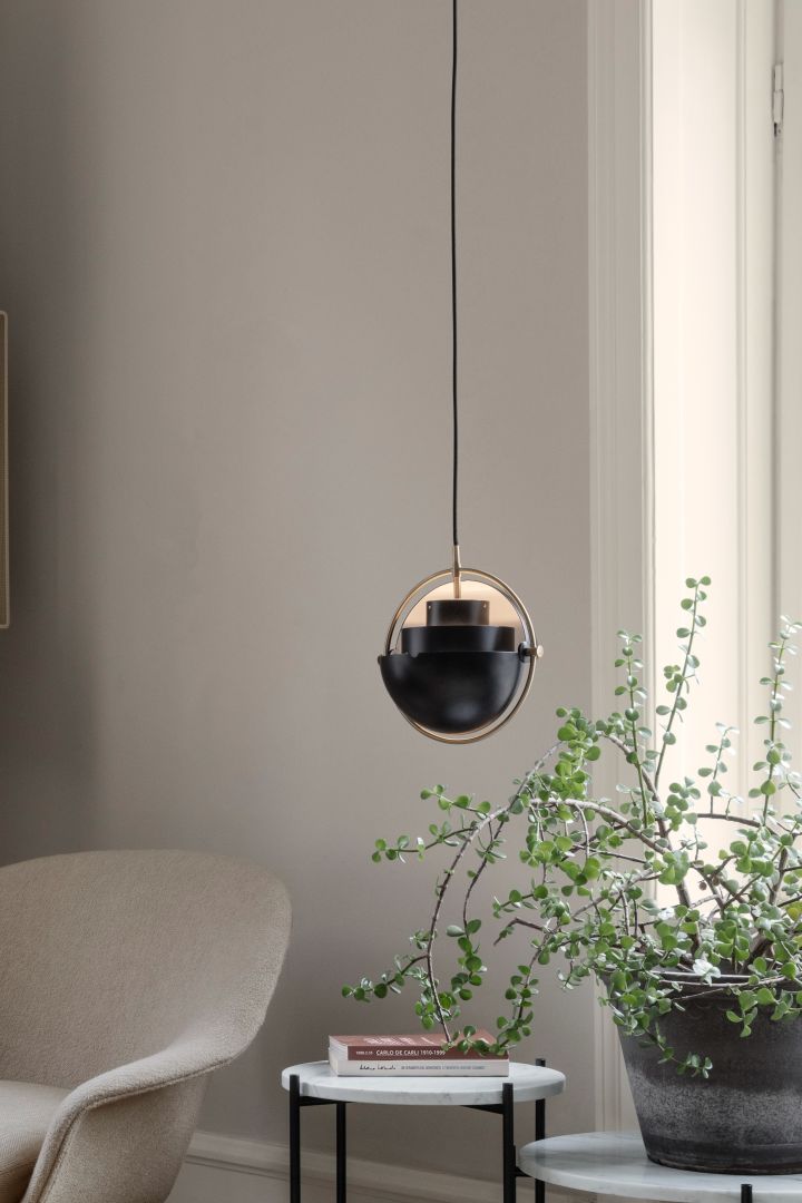 11 stylish ceiling lights to decorate your home with - here you see the Multi-Lite ceiling light from GUBI hanging above a plant. 
