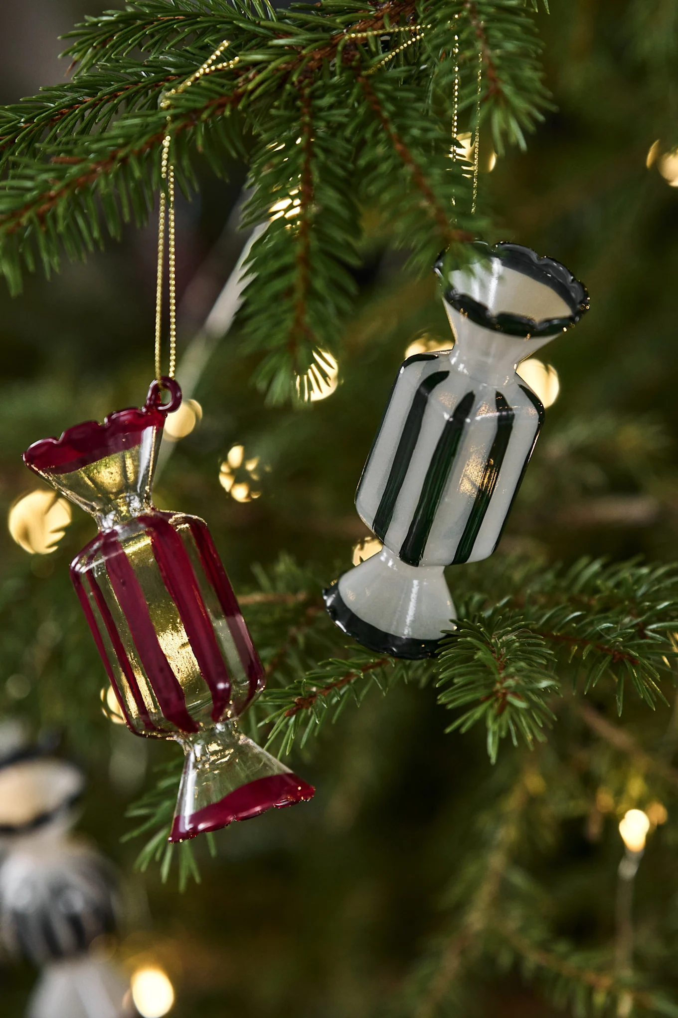 The Candy decorative pendants from Pluto Design are part of the 2025 Christmas decorations and are displayed here on a table.