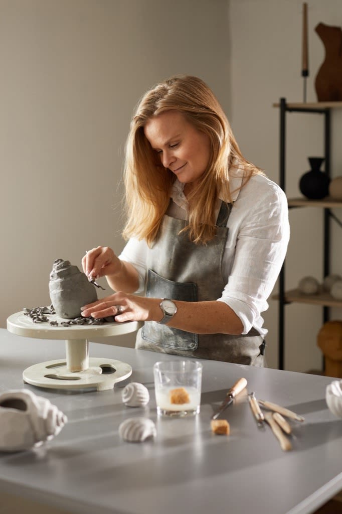 Designer Kristiina Haataia in the process of designing one of her sculptures for Cooee Design. 