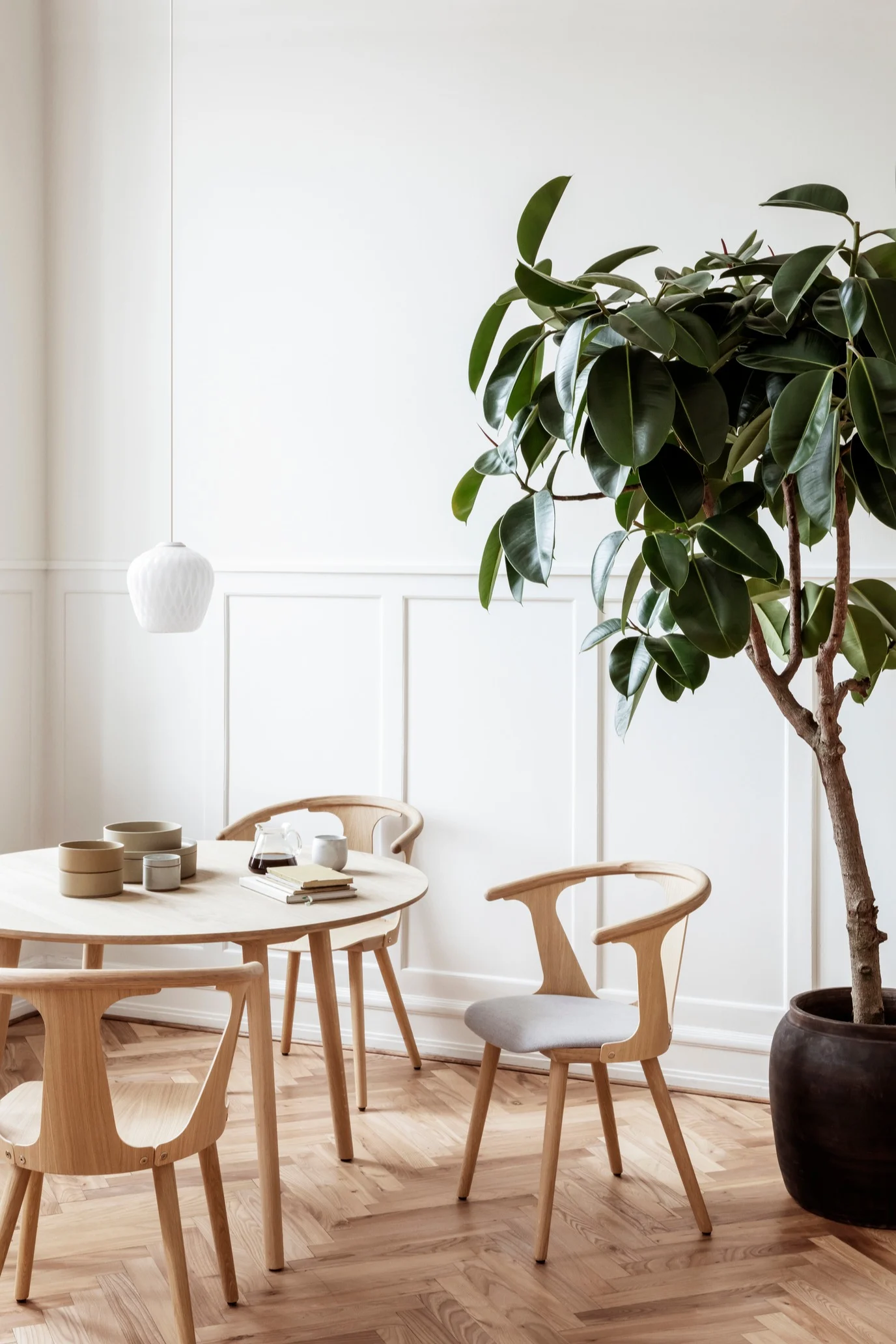 Wooden chairs from &tradition called In Between showcase simplistic Scandinavian design.