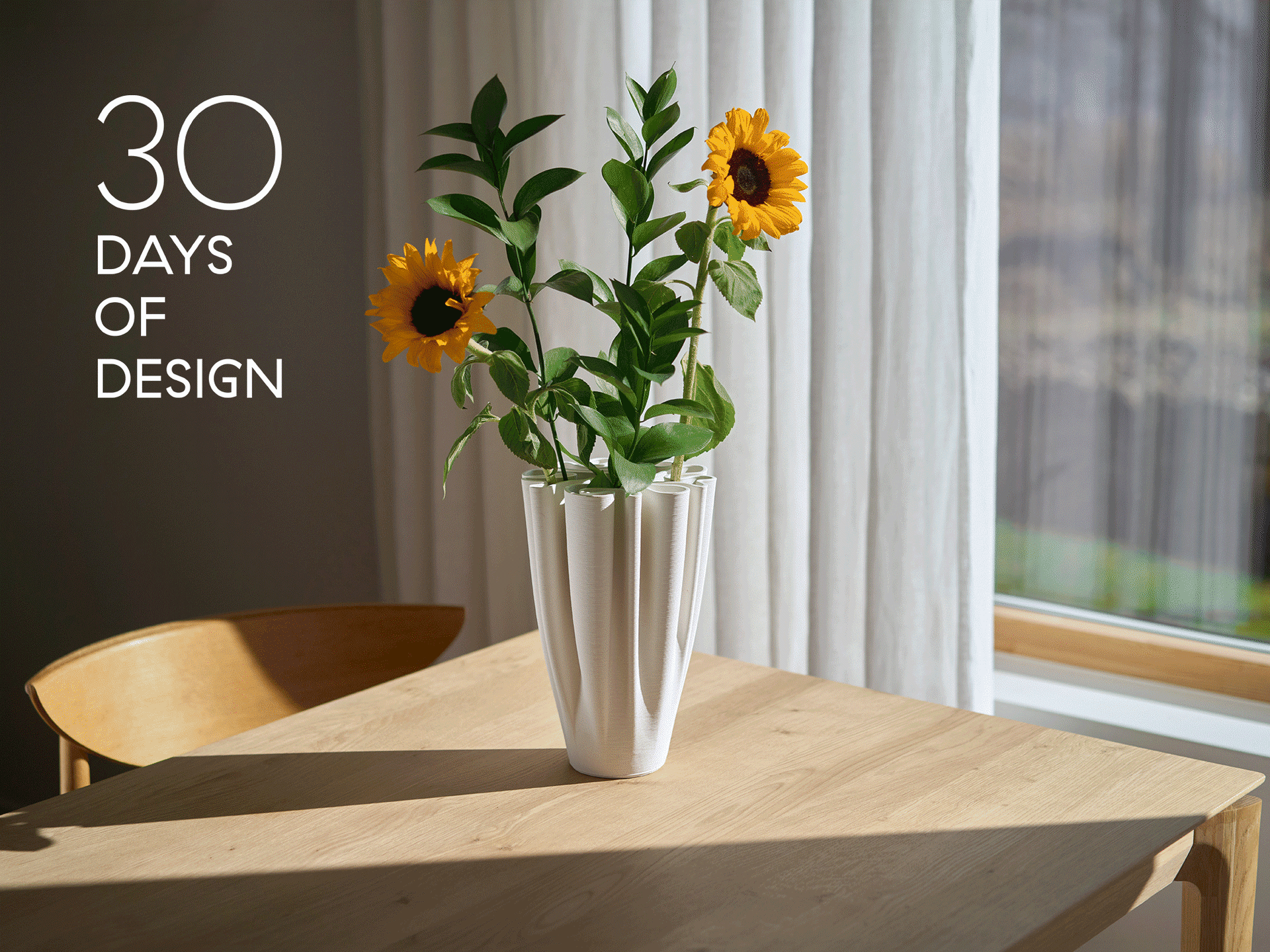 White pleated vase with sunflowers on a wooden table. Text reads '30 DAYS OF DESIGN'.
