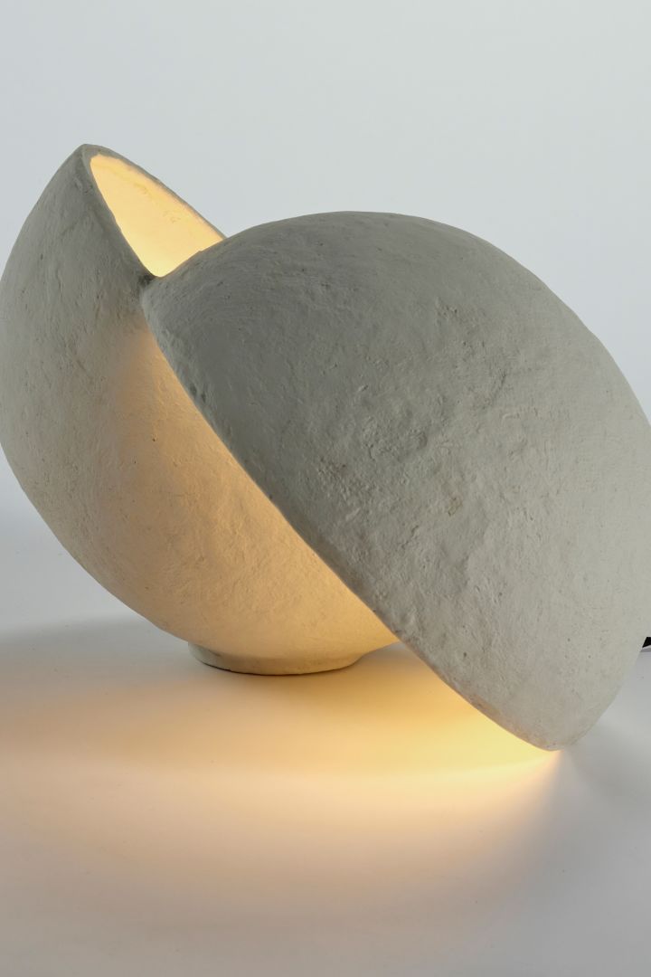 The Earth lamp from Serax looks like a planet that has been cut in half with light spilling from within each section - perfect for our desert themed interior design in 2022.