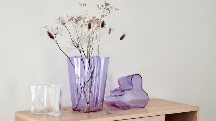 Alvar Aalto vases in amethyst with dried flowers, part of the anniversary collection from Iittala.