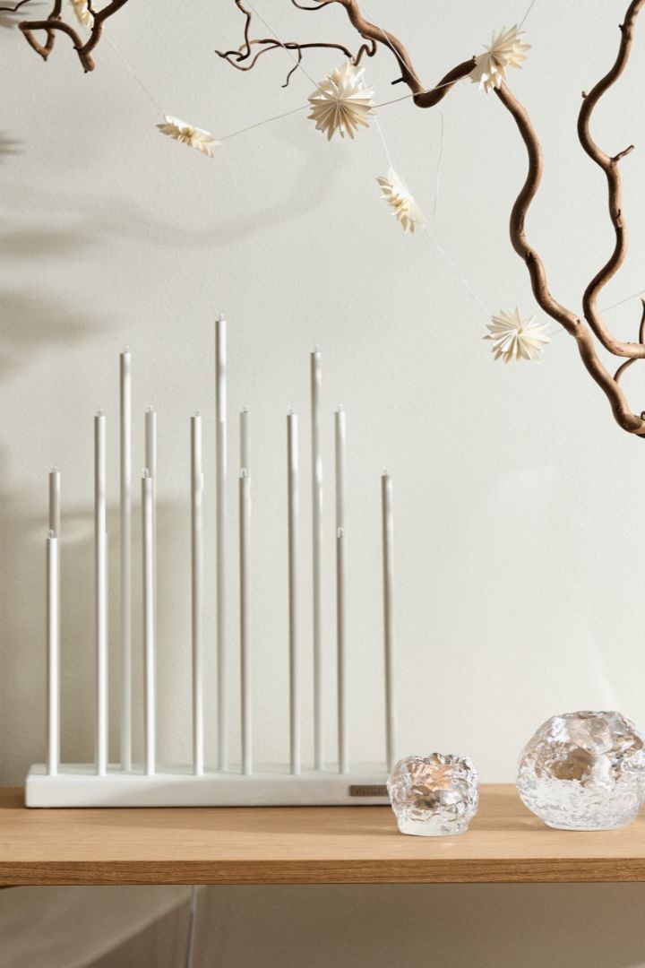 Stylish Christmas candle bridges to light your windowsill. Here you see the elegant and popular Elflugan candle bridge. 