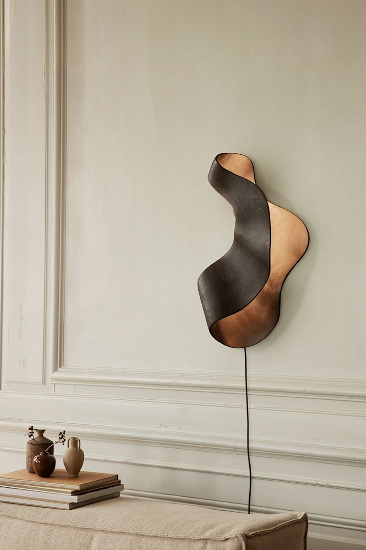 Refresh your home with modern wall lighting - here you see the Ferm Living Oyster wall lamp that looks like an oyster shell.