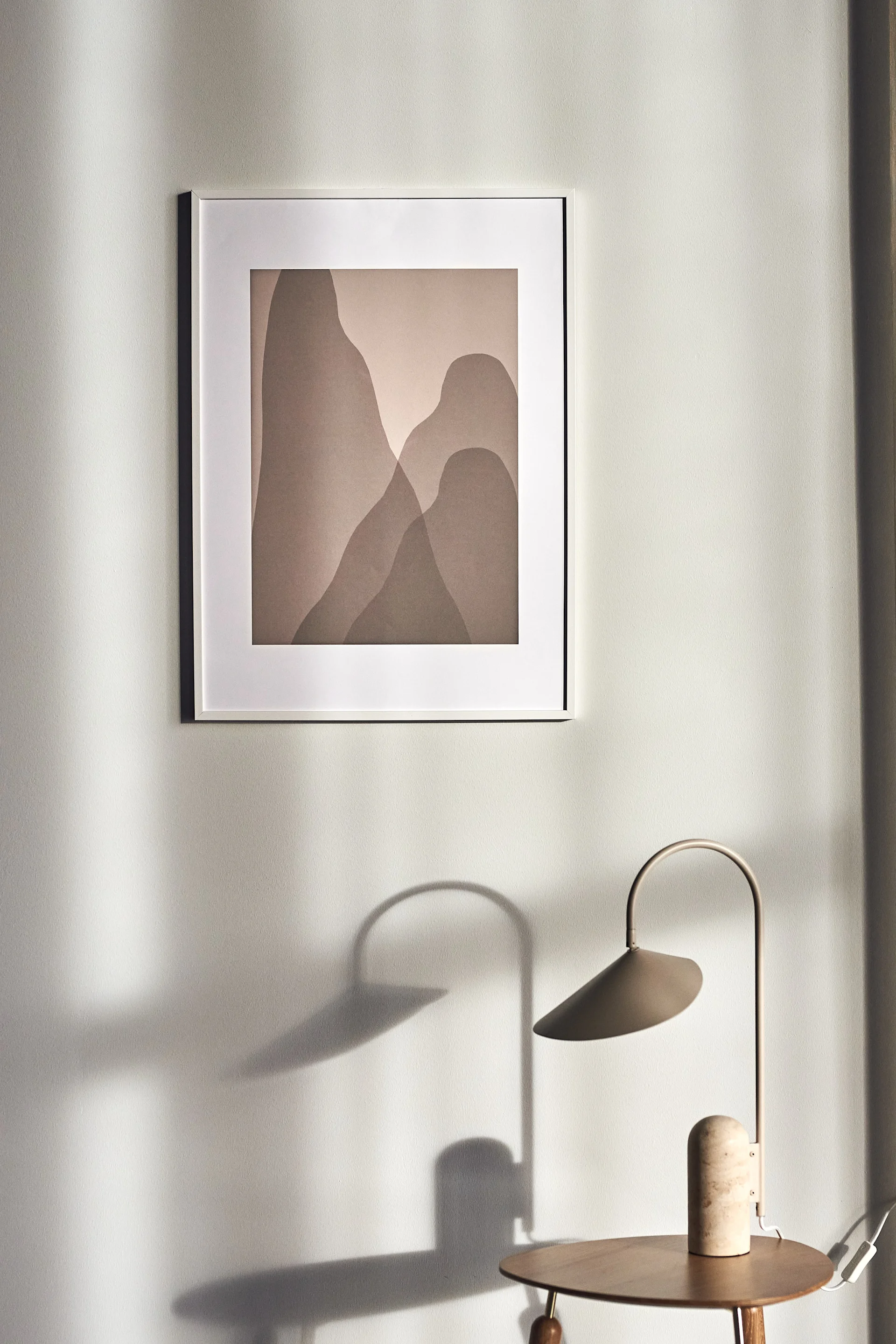 17 stylish Scandinavian wall posters to give your walls an update - here you see nature-inspired Arches poster from Scandi Living in tones of beige that resemble mountain peaks.