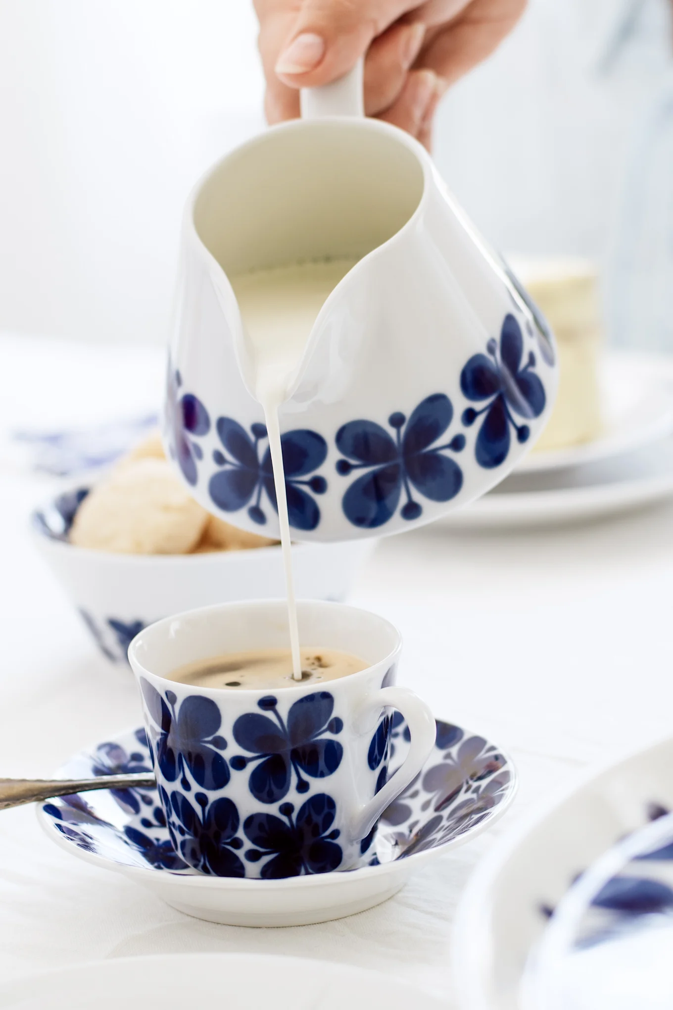 Coffee cups from Rörstrand are a Swedish classic, especially the blue and white Mon Amie collection, which is shown here on a table.