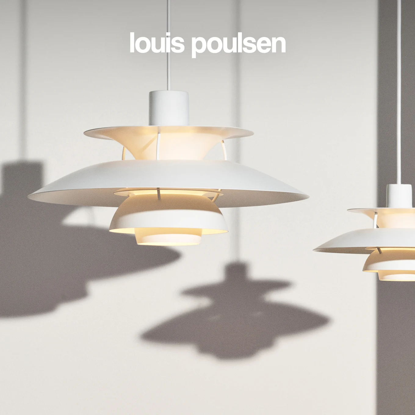 Two white multi-layered pendant lamps hang against a light background with shadows.
