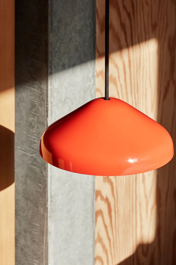 A colourful ceiling light for living rooms could be the Pao steel pendant from HAY, seen here in red.